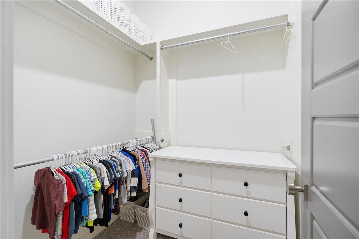 4506 140th Street Lubbock, TX 79424 - Photo 46 of 62 a view of walk in closet with clothes