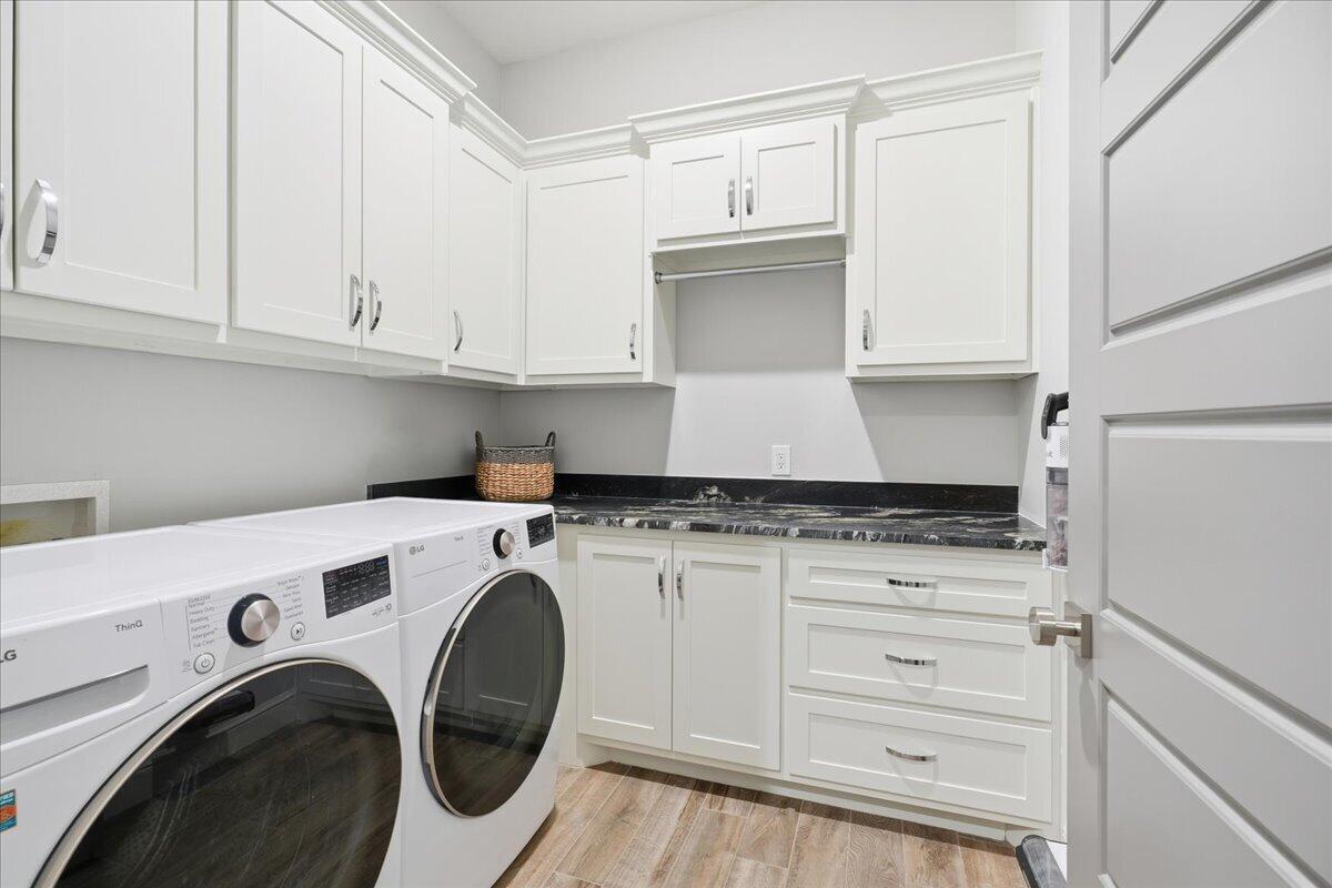 4506 140th Street Lubbock, TX 79424 - Photo 51 of 62 a utility room with sink dryer and washer