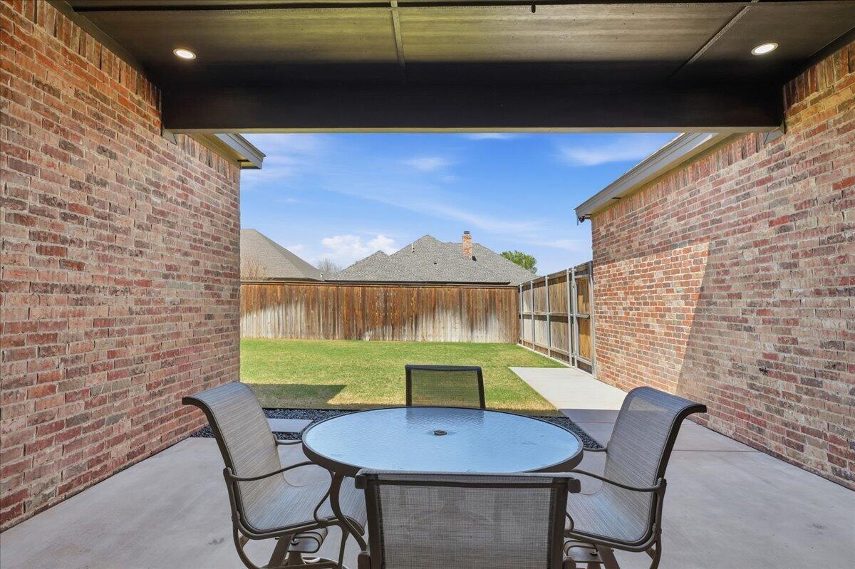 4506 140th Street Lubbock, TX 79424 - Photo 52 of 62 a balcony with table and chairs