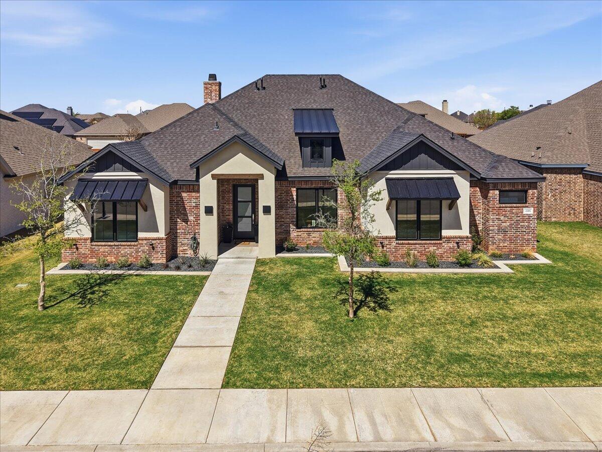 4506 140th Street Lubbock, TX 79424 - Photo 55 of 62 a front view of a house with a yard
