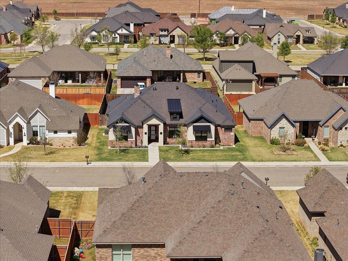 4506 140th Street Lubbock, TX 79424 - Photo 57 of 62 an aerial view of a house with a swimming pool