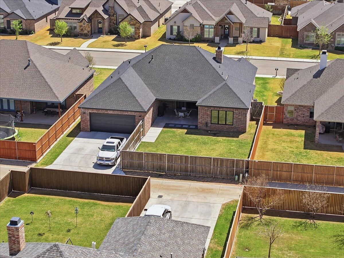 4506 140th Street Lubbock, TX 79424 - Photo 60 of 62 a view of a swimming pool with seating area