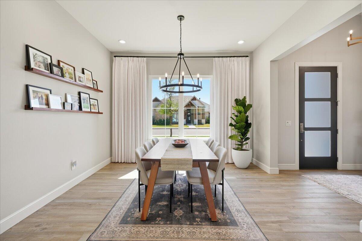 4506 140th Street Lubbock, TX 79424 - Photo 6 of 62 a view of a dining room with furniture window and wooden floor
