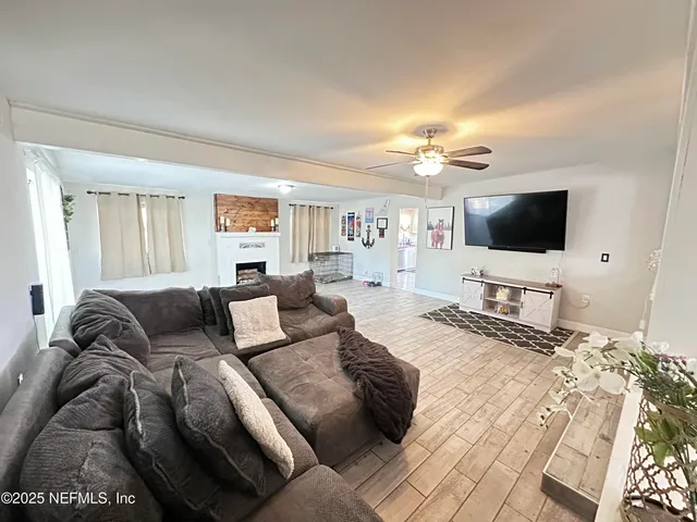a living room with furniture and a flat screen tv