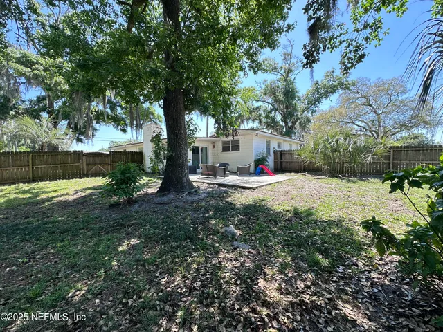 a view of a backyard with a small cabin
