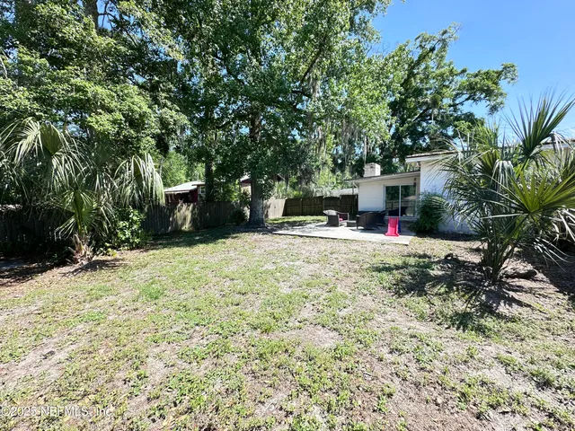 a view of outdoor space with deck and tree