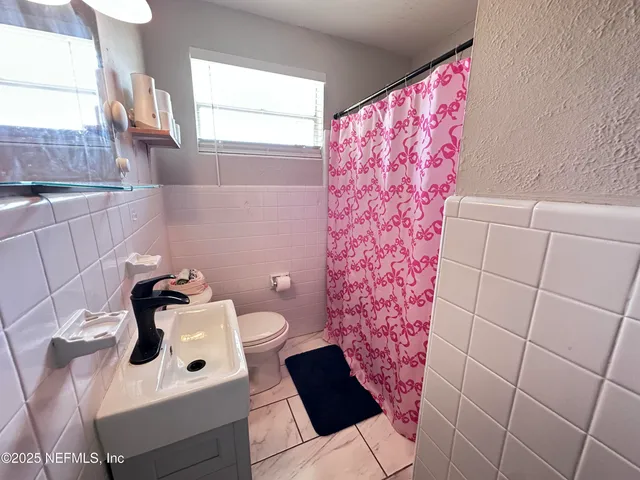 a bathroom with a sink and toilet