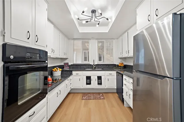 a view of kitchen with furniture and flat screen tv