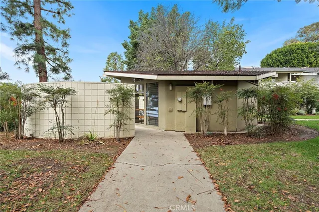 a view of a livingroom with furniture and an empty room