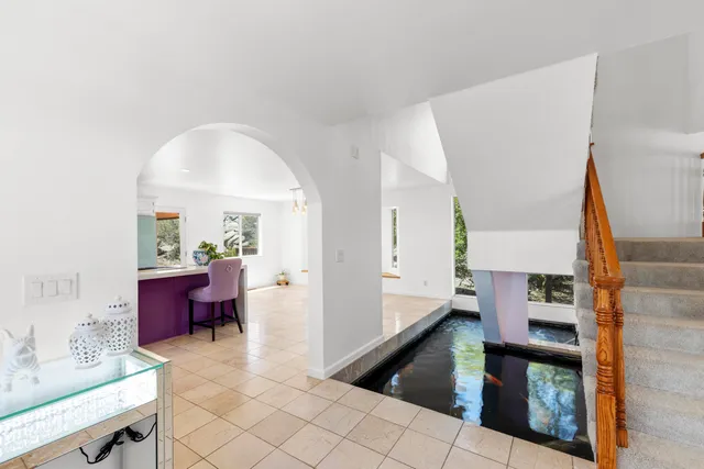 a kitchen with stainless steel appliances white cabinets and a counter top space