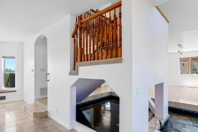 a kitchen with stainless steel appliances granite countertop a stove and a sink