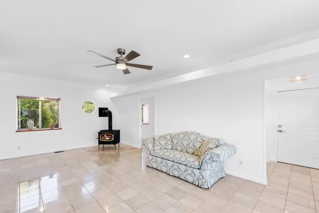 a balcony with wooden floor and stairs