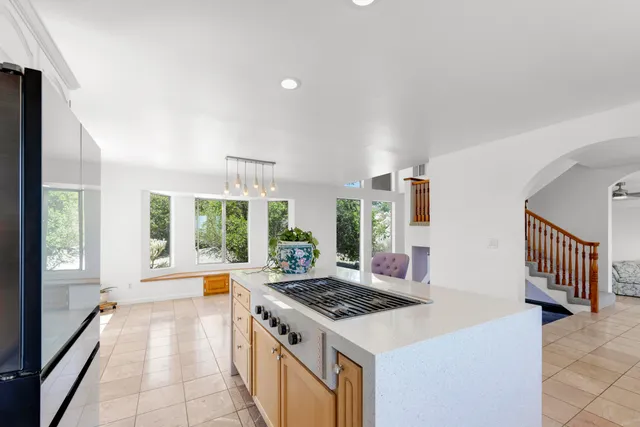 a view of a balcony with wooden fence and floor