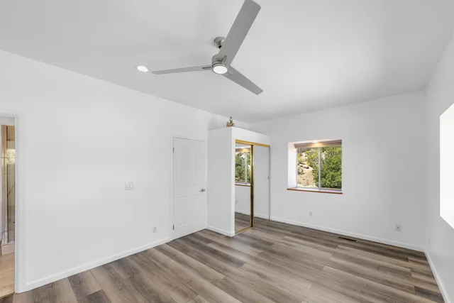 a bedroom with a bed and lamp