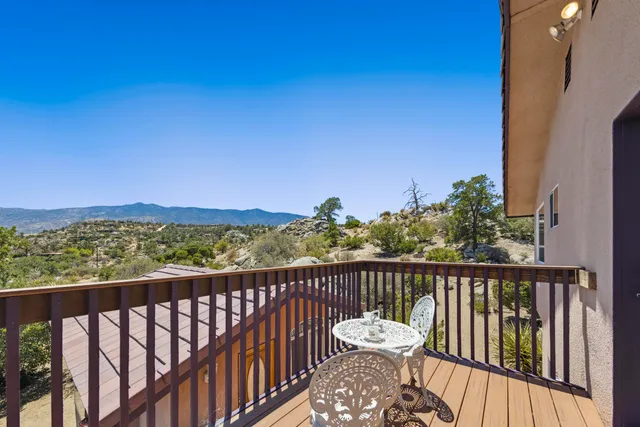 a view of livingroom with hardwood floor and a ceiling fan