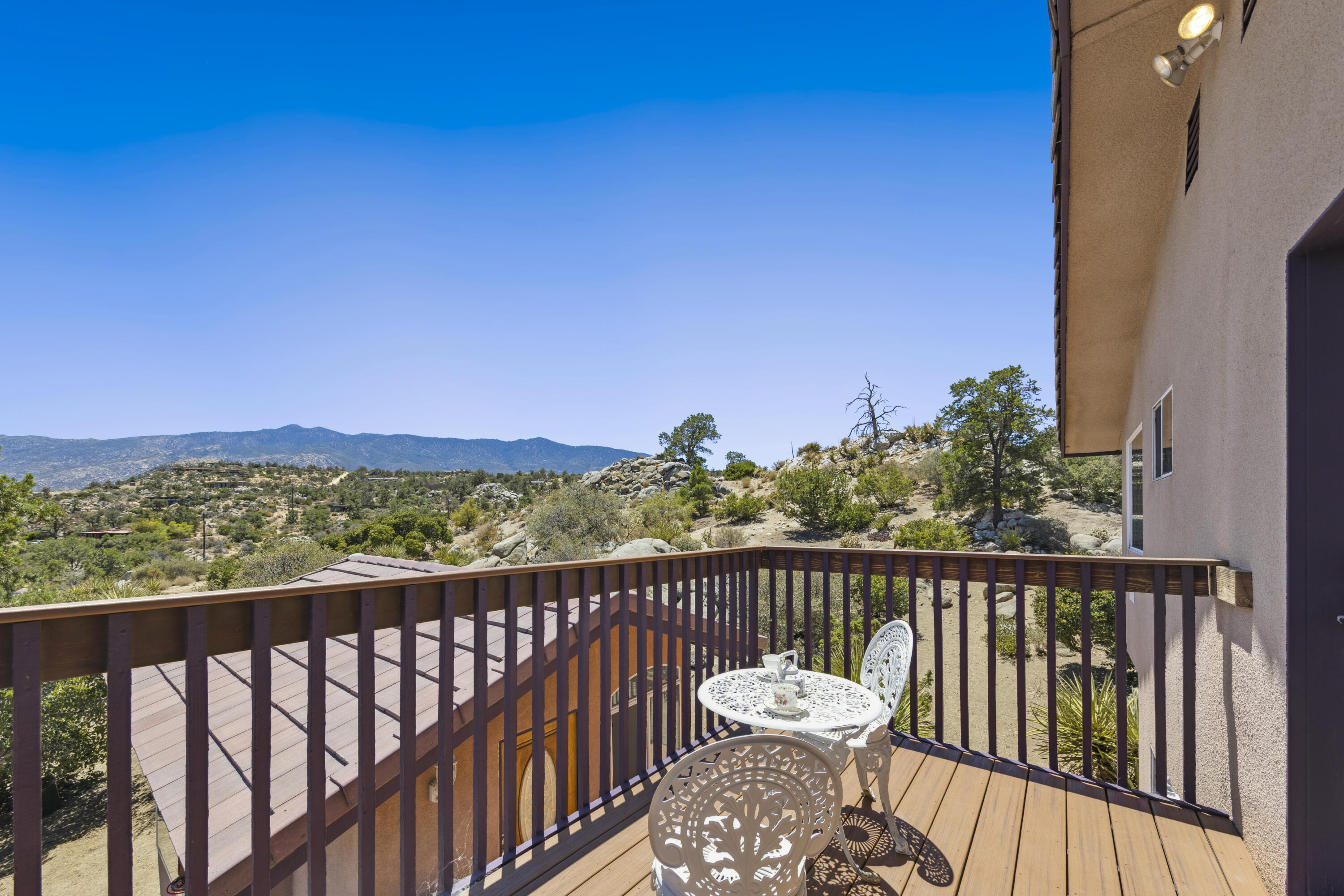 60425 Santa Rosa Road Mountain Center, CA 92561 - Photo 37 of 67 a view of a balcony with wooden fence and floor