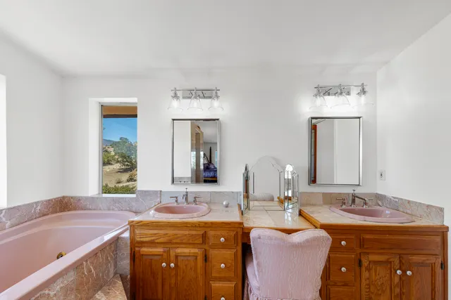 a view of a dry yard with trees