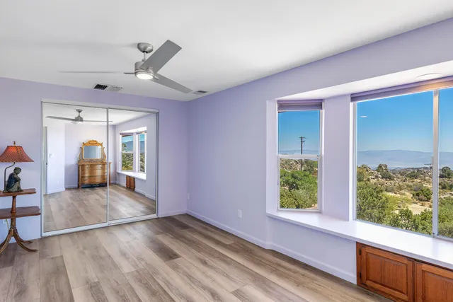 a view of a lake with a house in the background