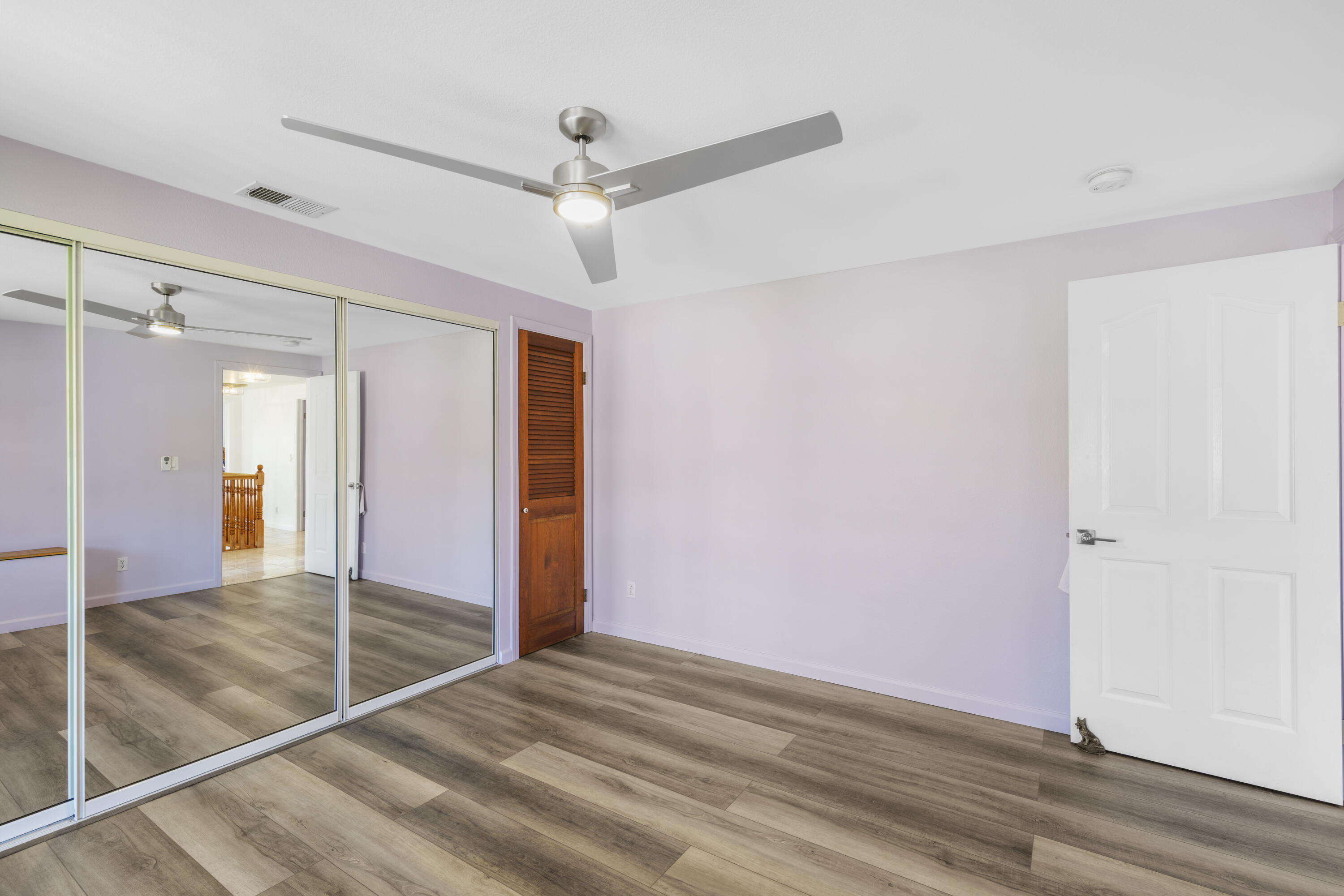 60425 Santa Rosa Road Mountain Center, CA 92561 - Photo 51 of 67 an empty space with wooden floor and a ceiling fan