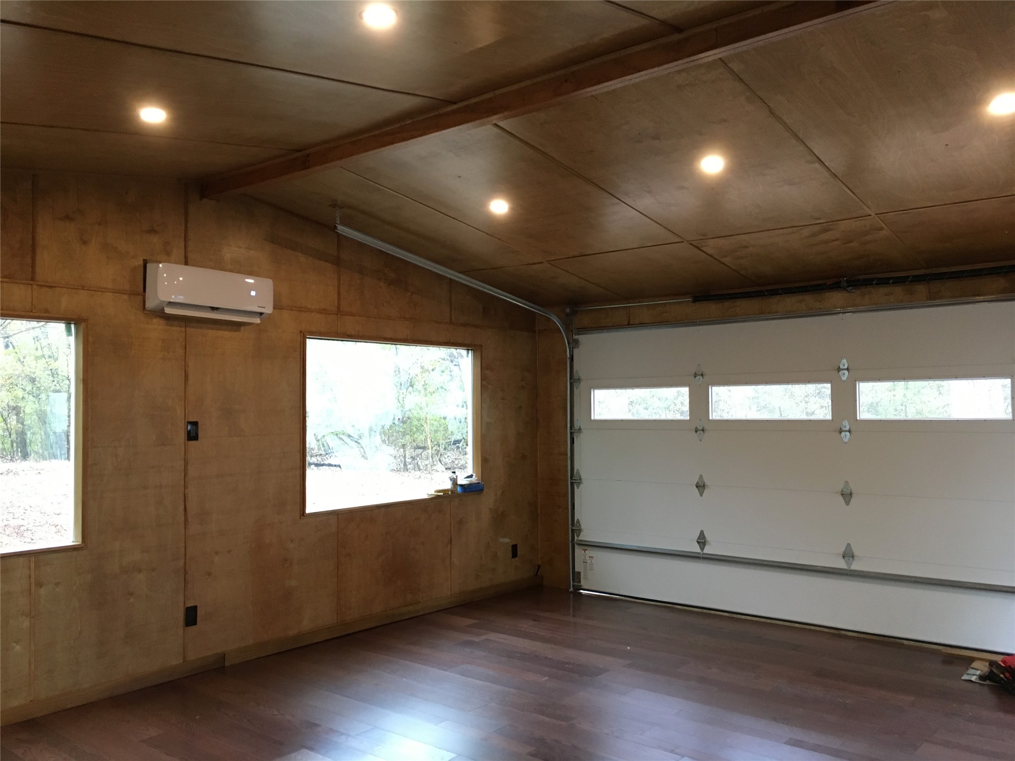 5405 Hudson Street Austin, TX 78721 - Photo 35 of 37 A well-appointed garage with natural wood walls and convenient window views.
