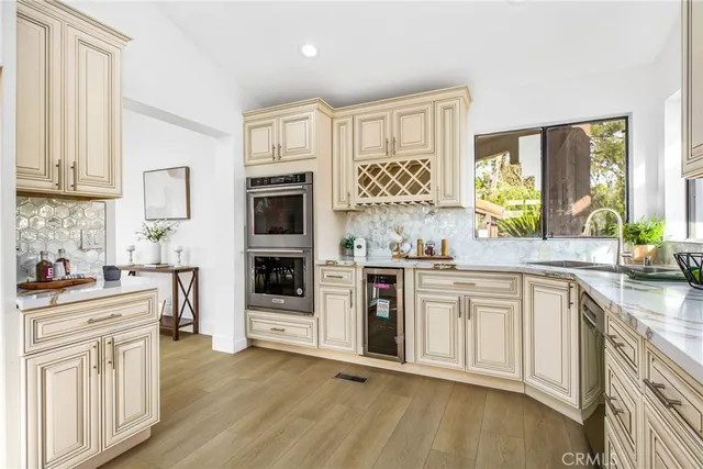 a spacious bedroom with a bed and cabinets