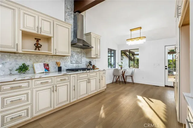 a kitchen with stainless steel appliances granite countertop a sink and a wooden cabinets