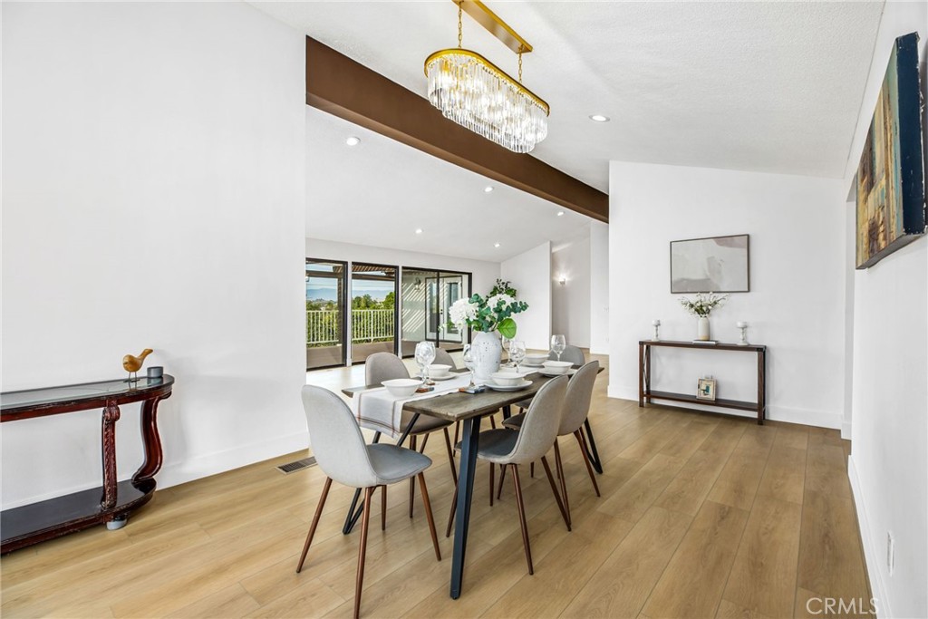 16066 Rancho Verde Circle Riverside, CA 92506 - Photo 19 of 51 a view of a dining room with furniture and a window