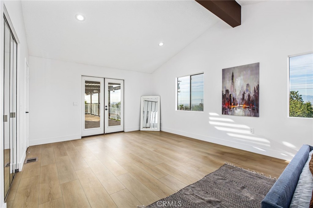 16066 Rancho Verde Circle Riverside, CA 92506 - Photo 21 of 51 a view of livingroom with hardwood floor and cabinet