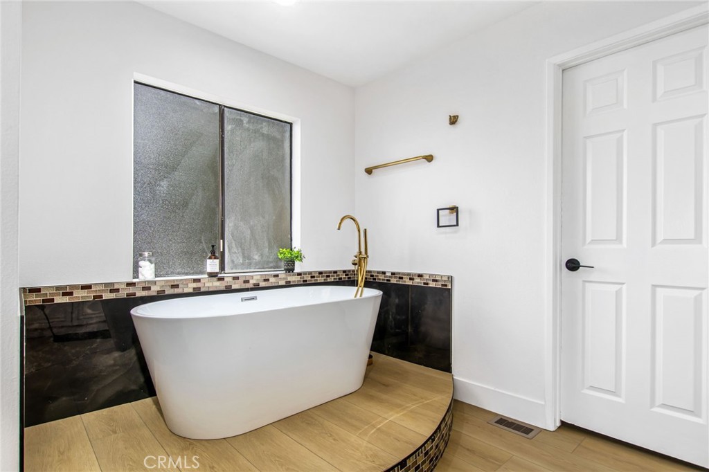 16066 Rancho Verde Circle Riverside, CA 92506 - Photo 25 of 51 a living room with wooden floor and sink