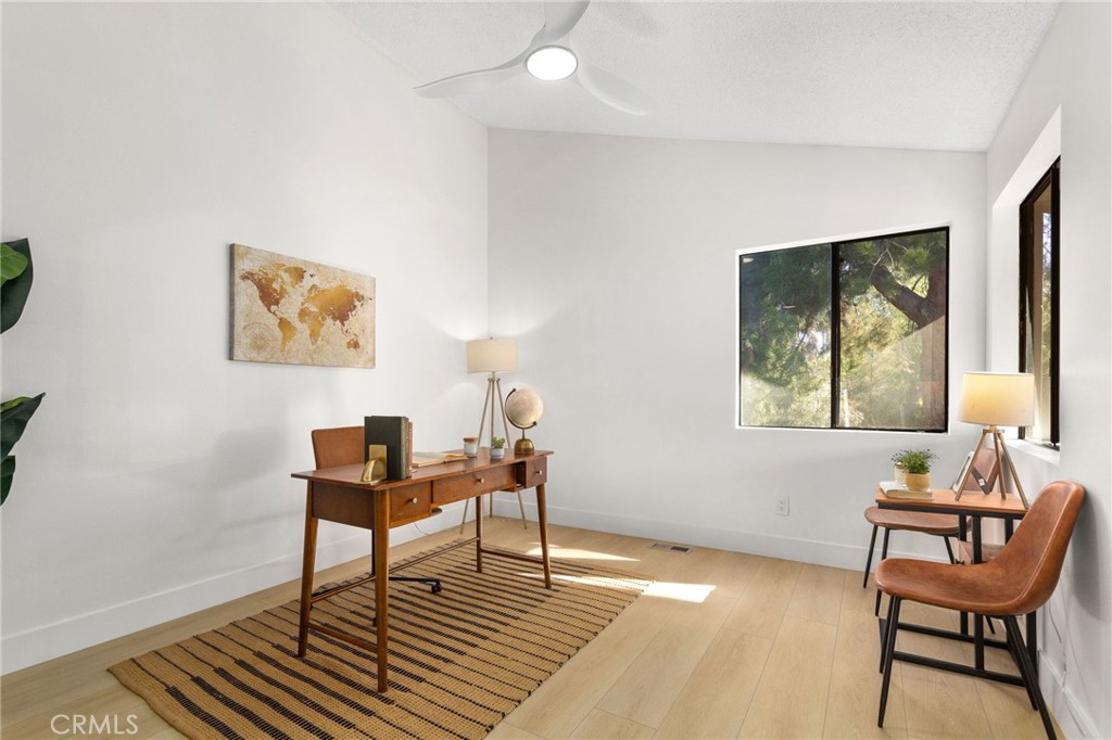 16066 Rancho Verde Circle Riverside, CA 92506 - Photo 27 of 51 a living room with furniture and a window