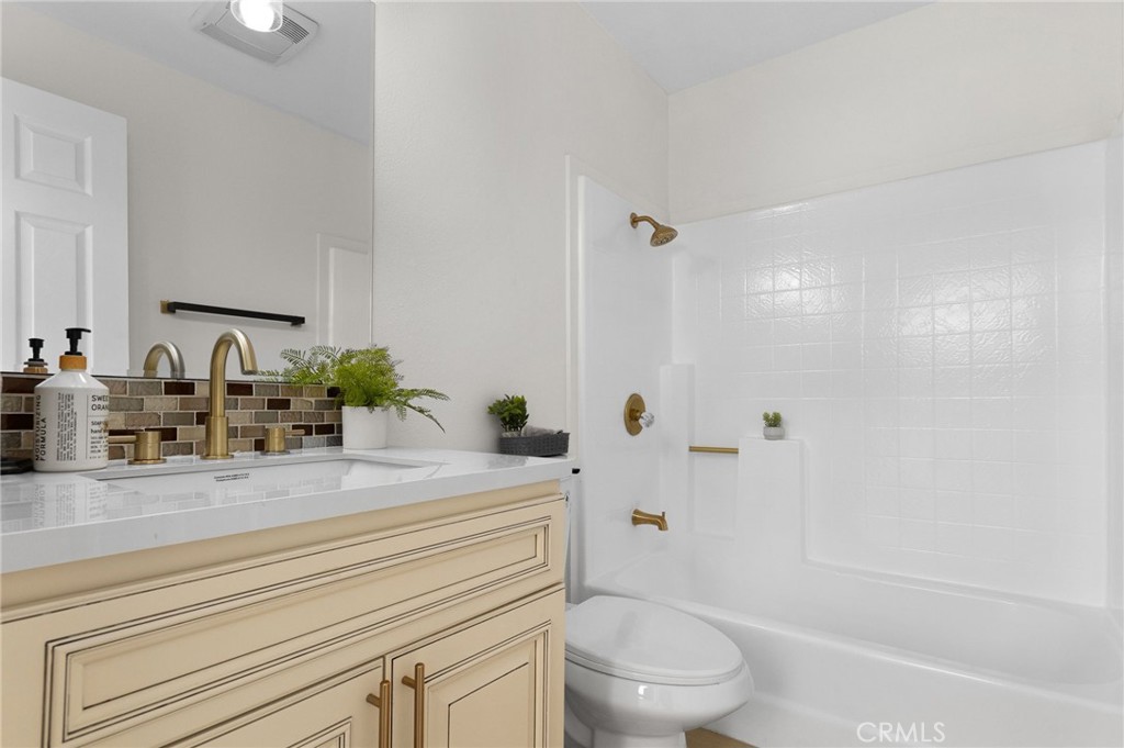 16066 Rancho Verde Circle Riverside, CA 92506 - Photo 28 of 51 a bathroom with a sink a toilet and shower