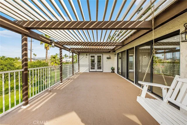 a view of a balcony with a swimming pool