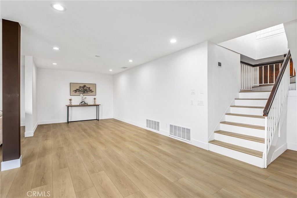 16066 Rancho Verde Circle Riverside, CA 92506 - Photo 33 of 51 a view of an empty room with stairs and a furniture