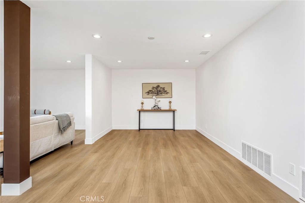 16066 Rancho Verde Circle Riverside, CA 92506 - Photo 34 of 51 a view of a livingroom with wooden floor