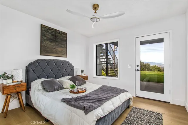 a bathroom with a toilet a sink and a mirror