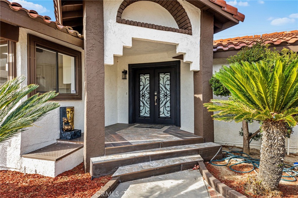 16066 Rancho Verde Circle Riverside, CA 92506 - Photo 6 of 51 a view of front door and potted plants