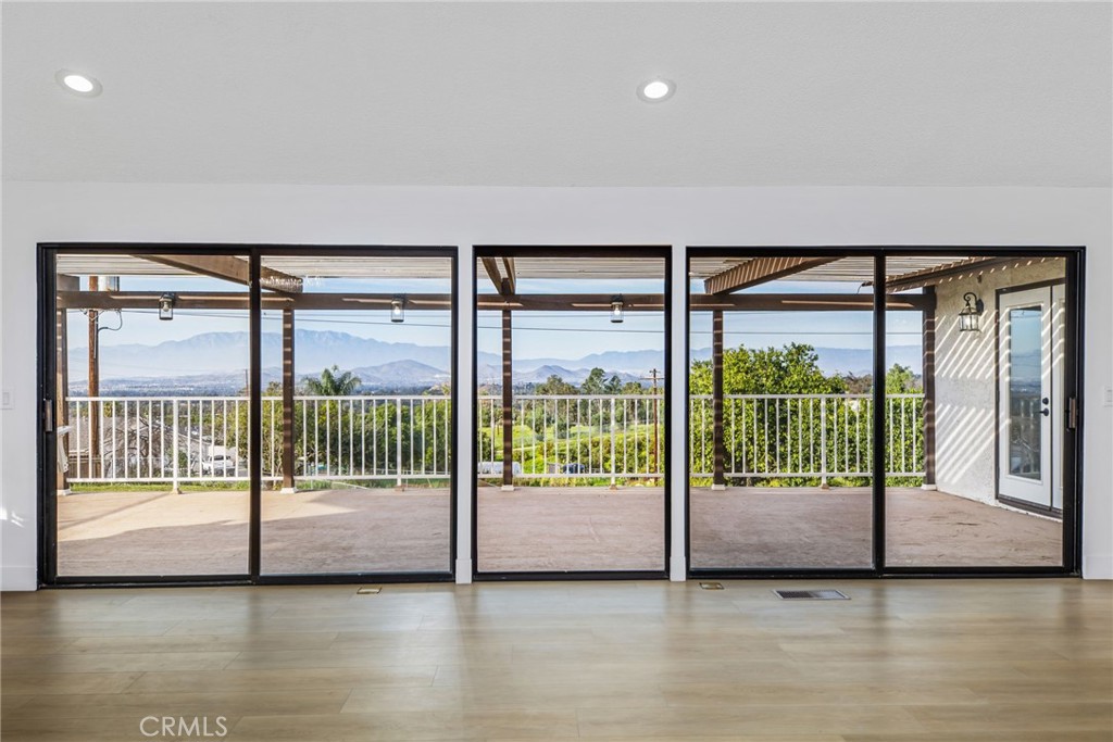 16066 Rancho Verde Circle Riverside, CA 92506 - Photo 10 of 51 a view of a room with wooden floor and balcony