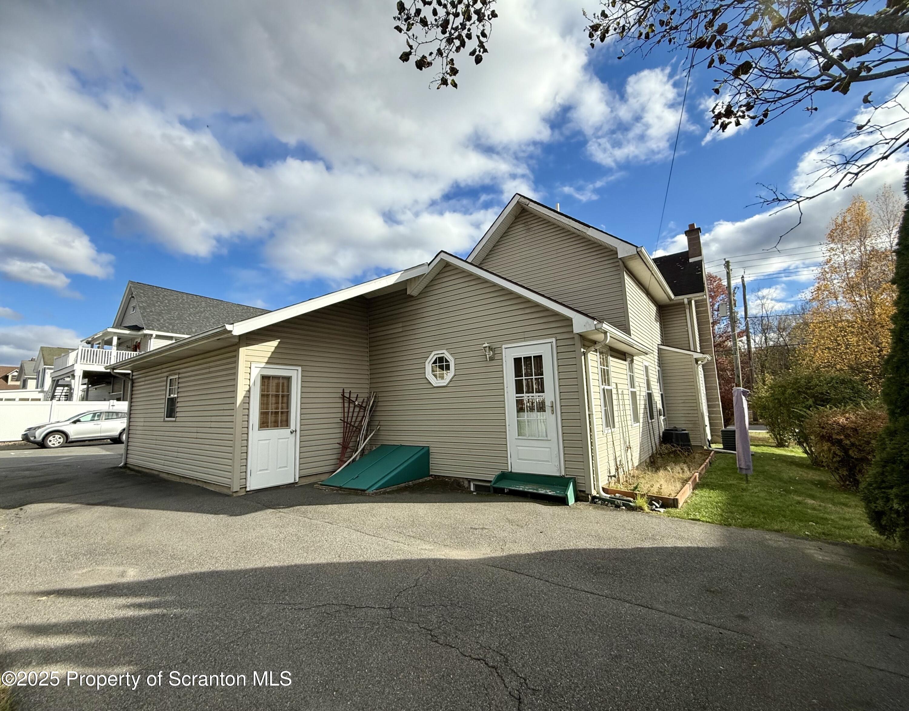 302 Main Street Blakely, PA 18452 - Photo 11 of 38 a house view with a backyard