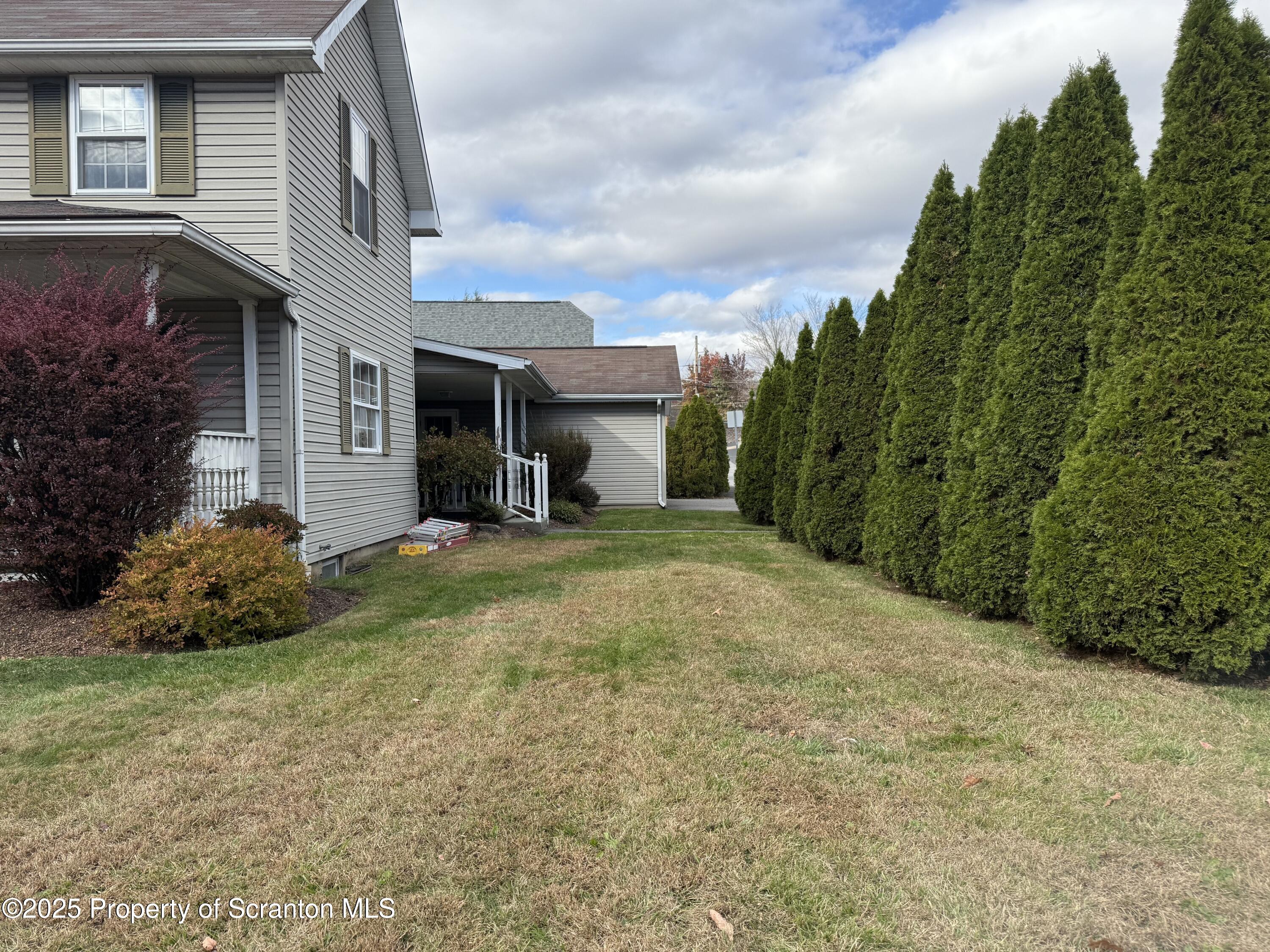 302 Main Street Blakely, PA 18452 - Photo 14 of 38 a view of a house with backyard and garden