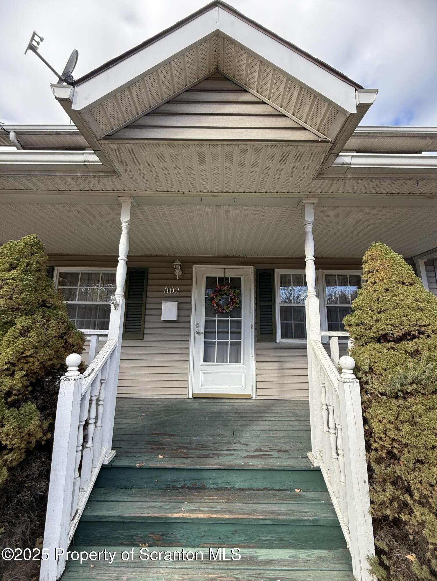 302 Main Street Blakely, PA 18452 - Photo 16 of 38 a front view of a house with a porch