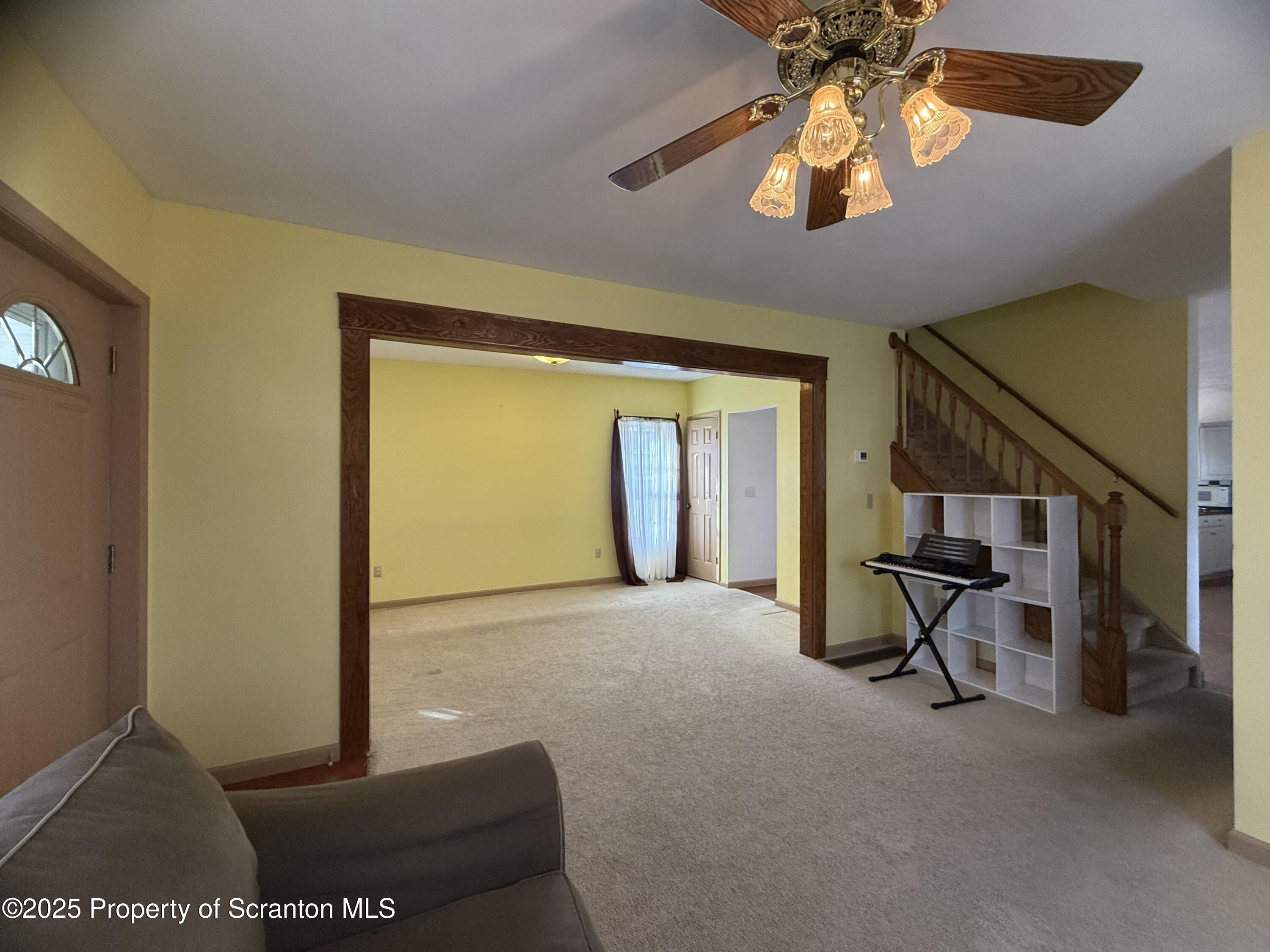 302 Main Street Blakely, PA 18452 - Photo 18 of 38 a view of a livingroom with a furniture and chandelier fan