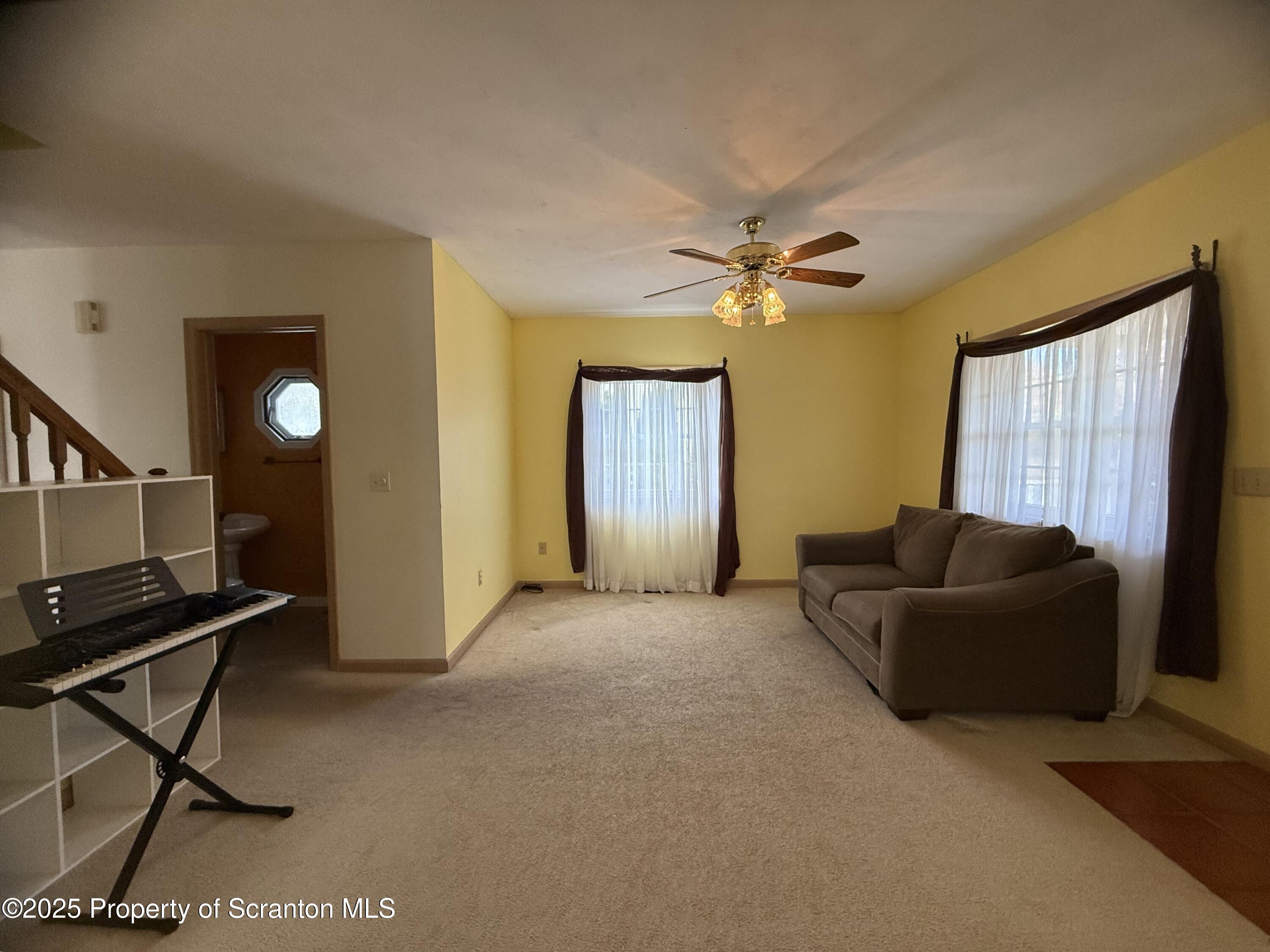 302 Main Street Blakely, PA 18452 - Photo 19 of 38 a living room with furniture and a window