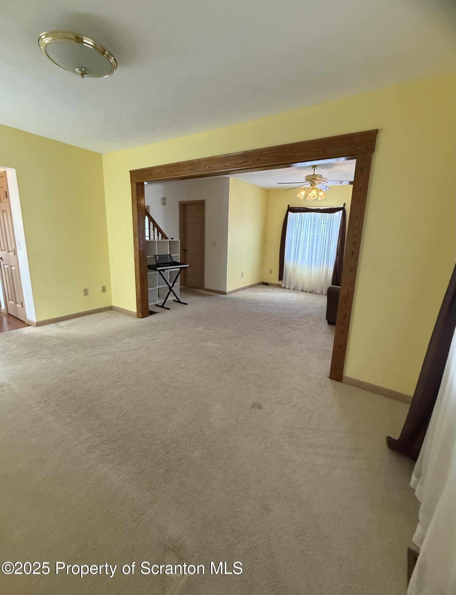 302 Main Street Blakely, PA 18452 - Photo 20 of 38 a view of an empty room with furniture and a window