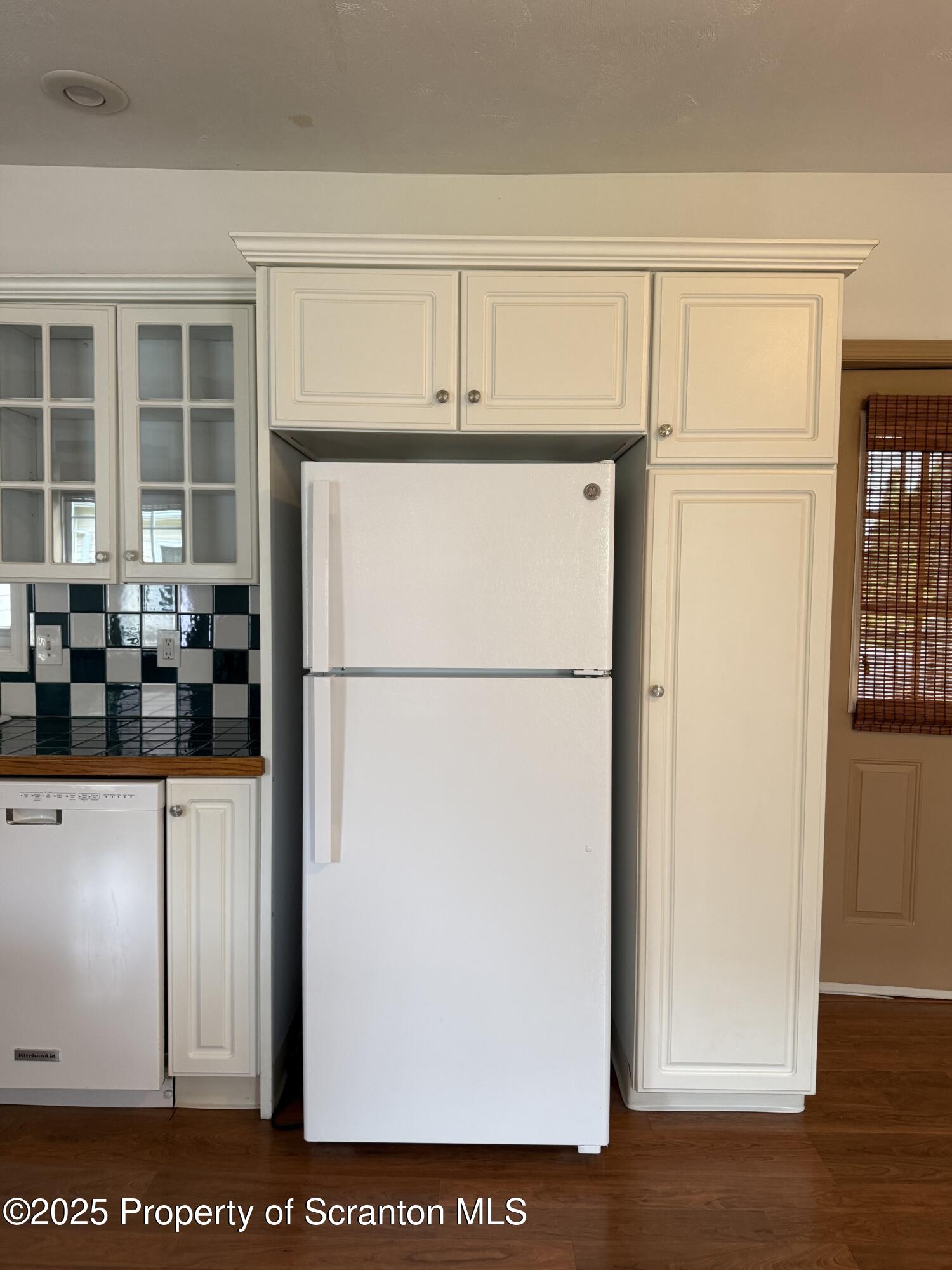 302 Main Street Blakely, PA 18452 - Photo 24 of 38 a view of kitchen with refrigerator and wooden floor