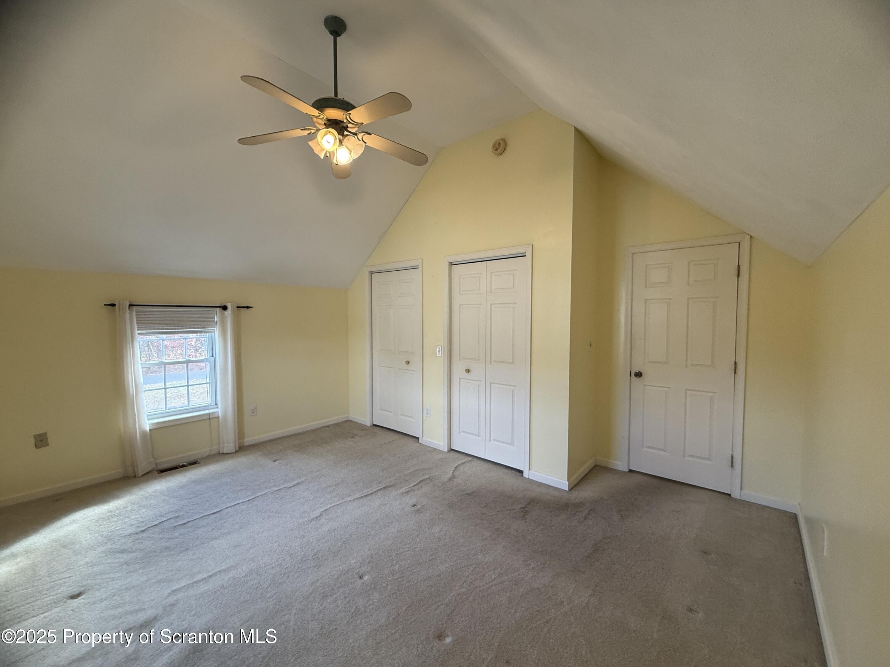 302 Main Street Blakely, PA 18452 - Photo 33 of 38 a view of an empty room with window and wooden floor