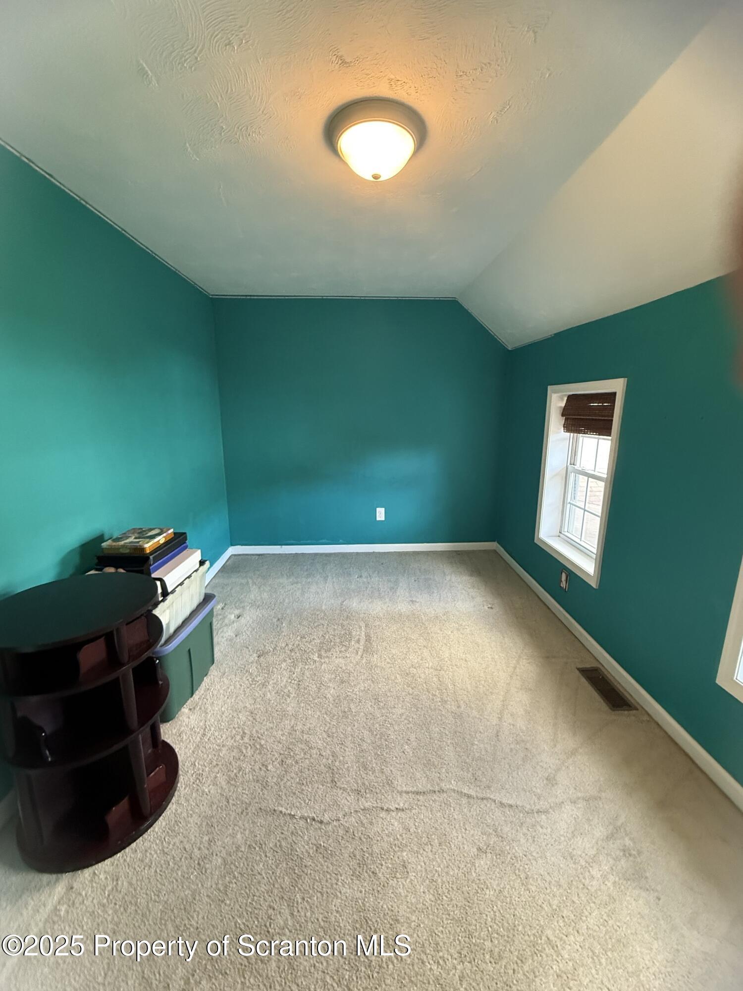 302 Main Street Blakely, PA 18452 - Photo 34 of 38 a living room with a black gate