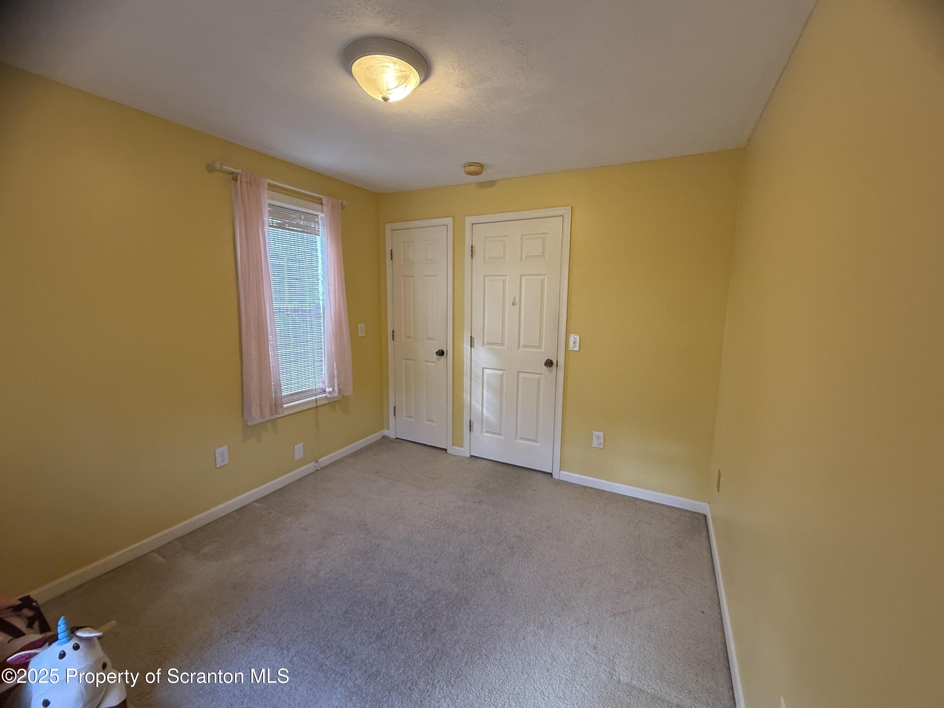 302 Main Street Blakely, PA 18452 - Photo 37 of 38 an empty room with windows