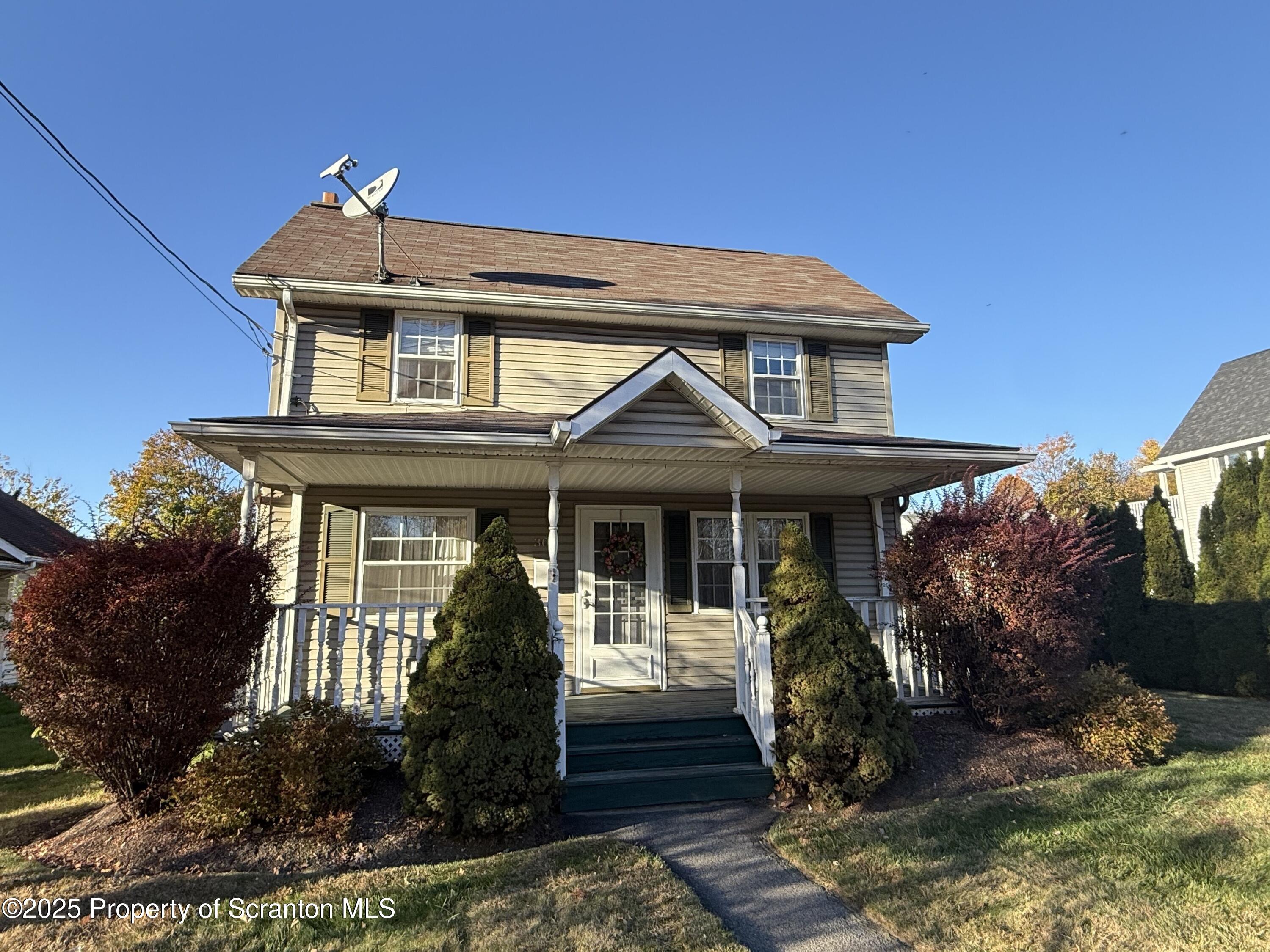 302 Main Street Blakely, PA 18452 - Photo 38 of 38 a front view of a house with garden