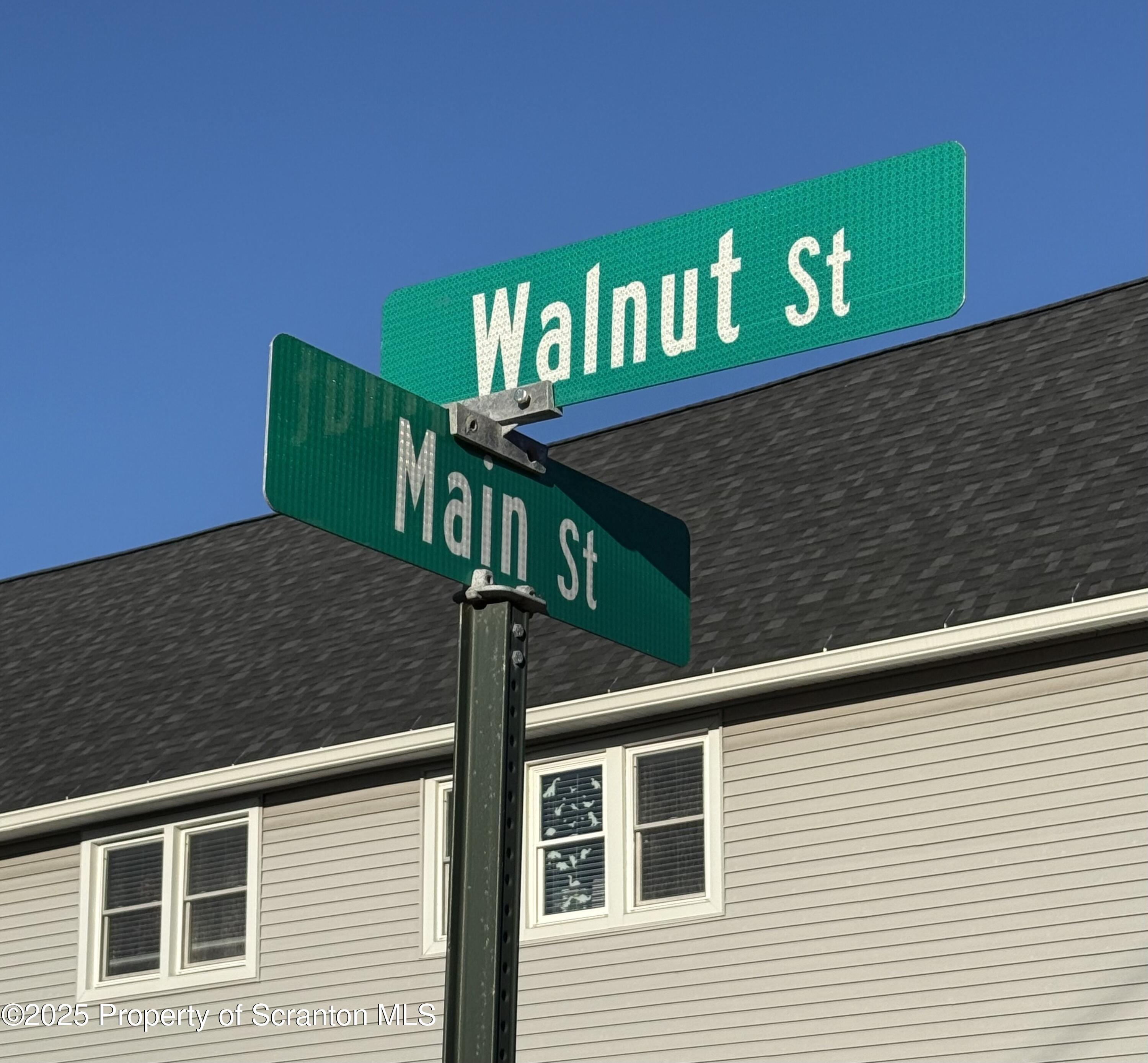 302 Main Street Blakely, PA 18452 - Photo 5 of 38 a view of a brick wall with windows