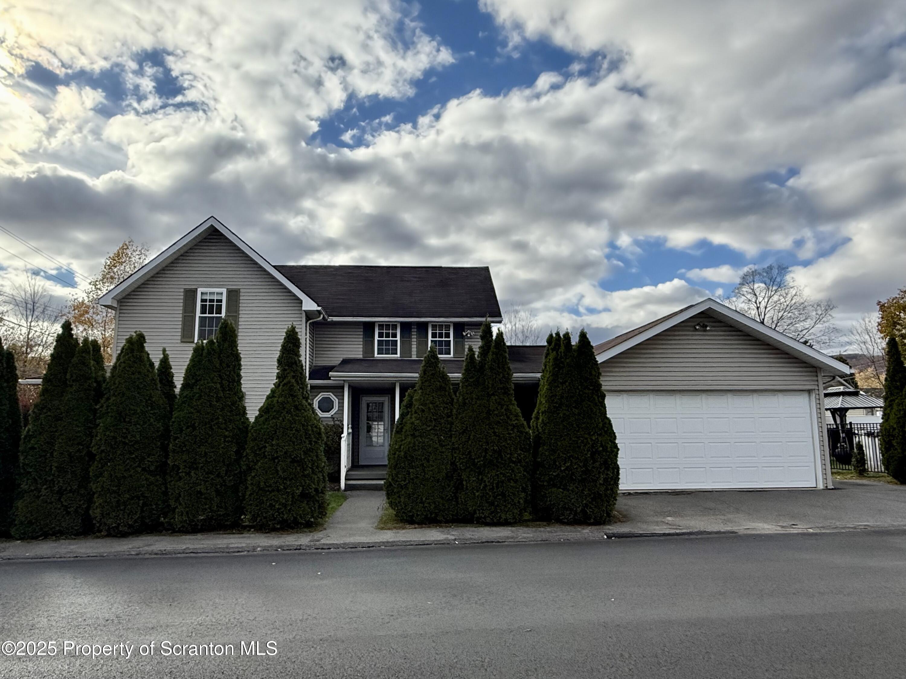 302 Main Street Blakely, PA 18452 - Photo 6 of 38 a view of a house with a backyard